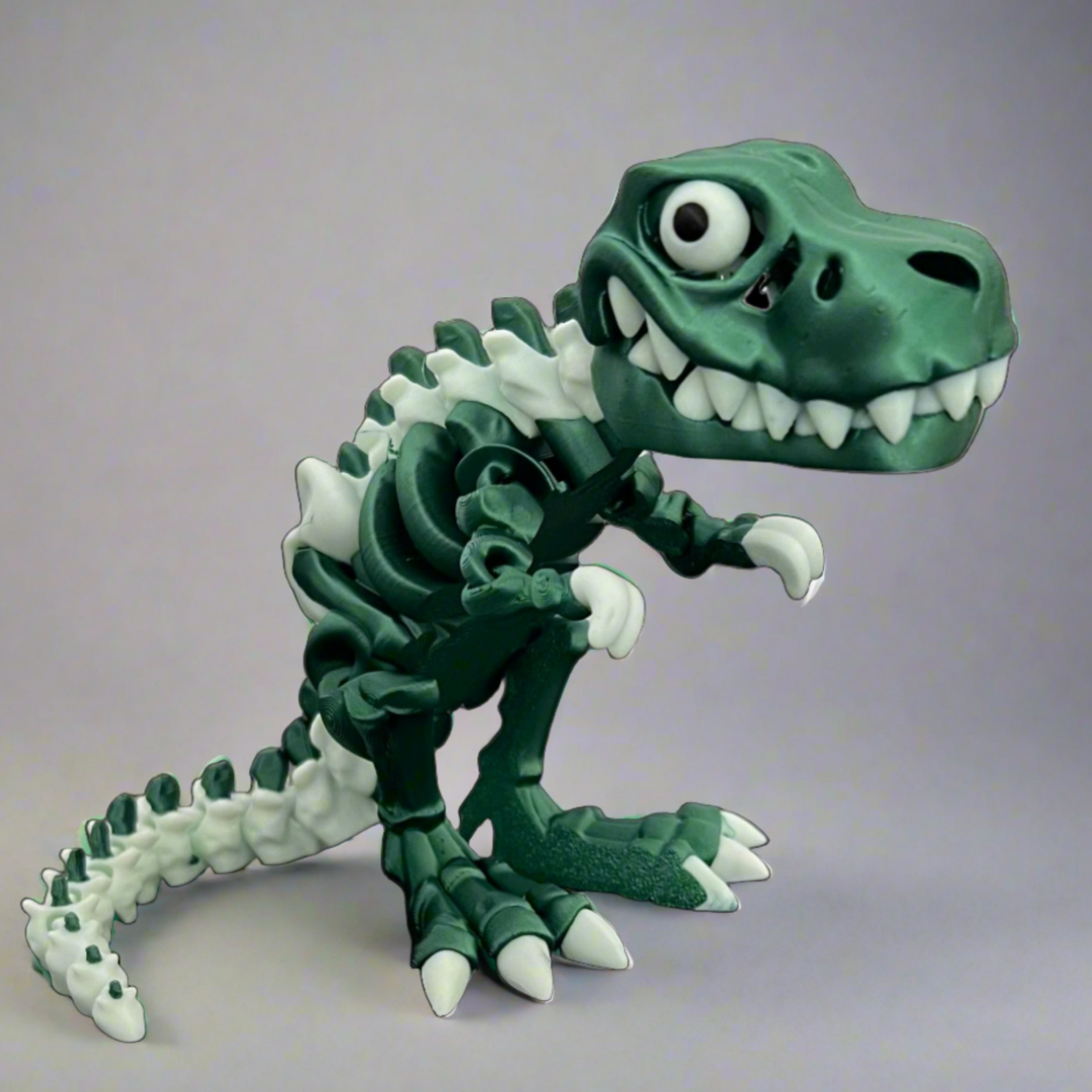 Limited series articulated Tyrannosaurus Rex skeleton sensory toy in metallic green and white.