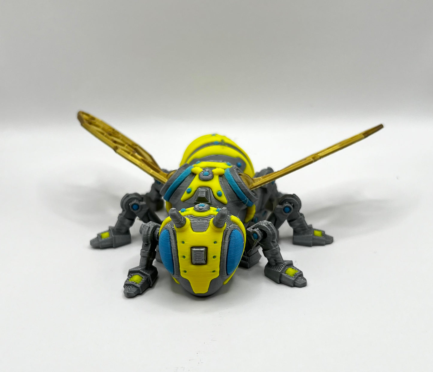 Close-up of the RoboBee's head and front legs, emphasizing the precision and craftsmanship of the 3D printing process.