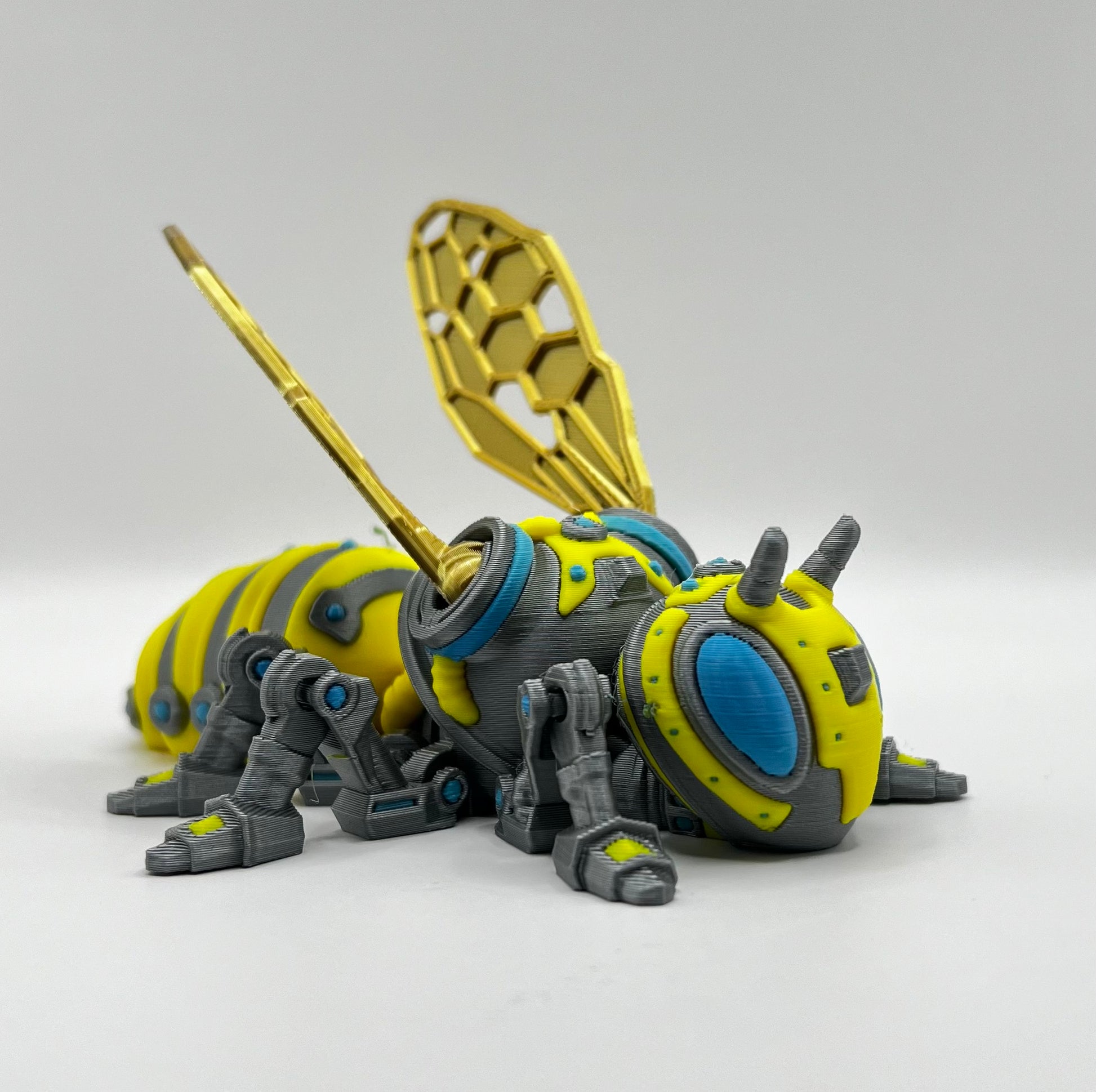 Side view of the RoboBee model, highlighting its detailed wings and mechanical features in high-quality 3D print.